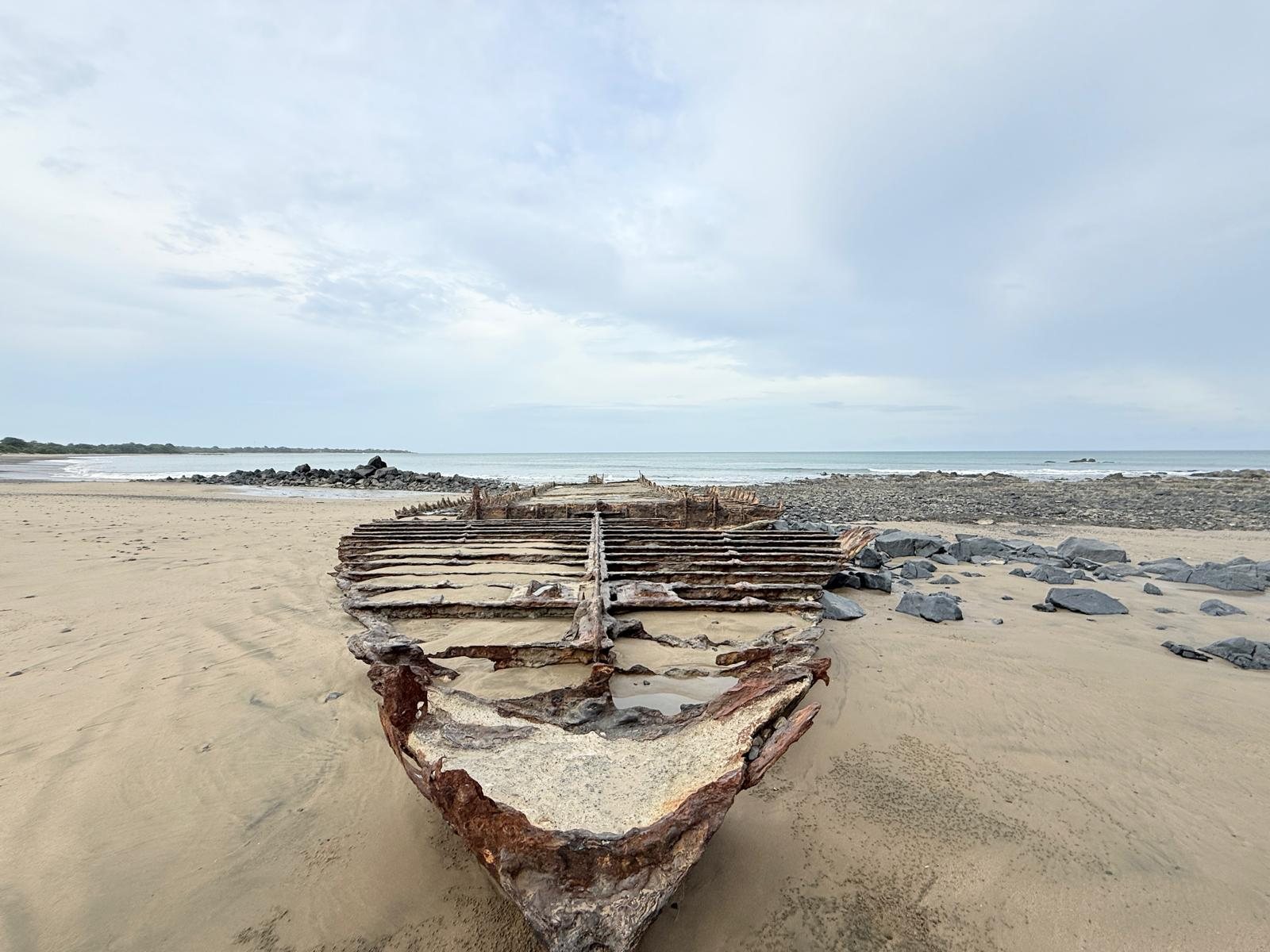 The old wooden wreck on the sand
