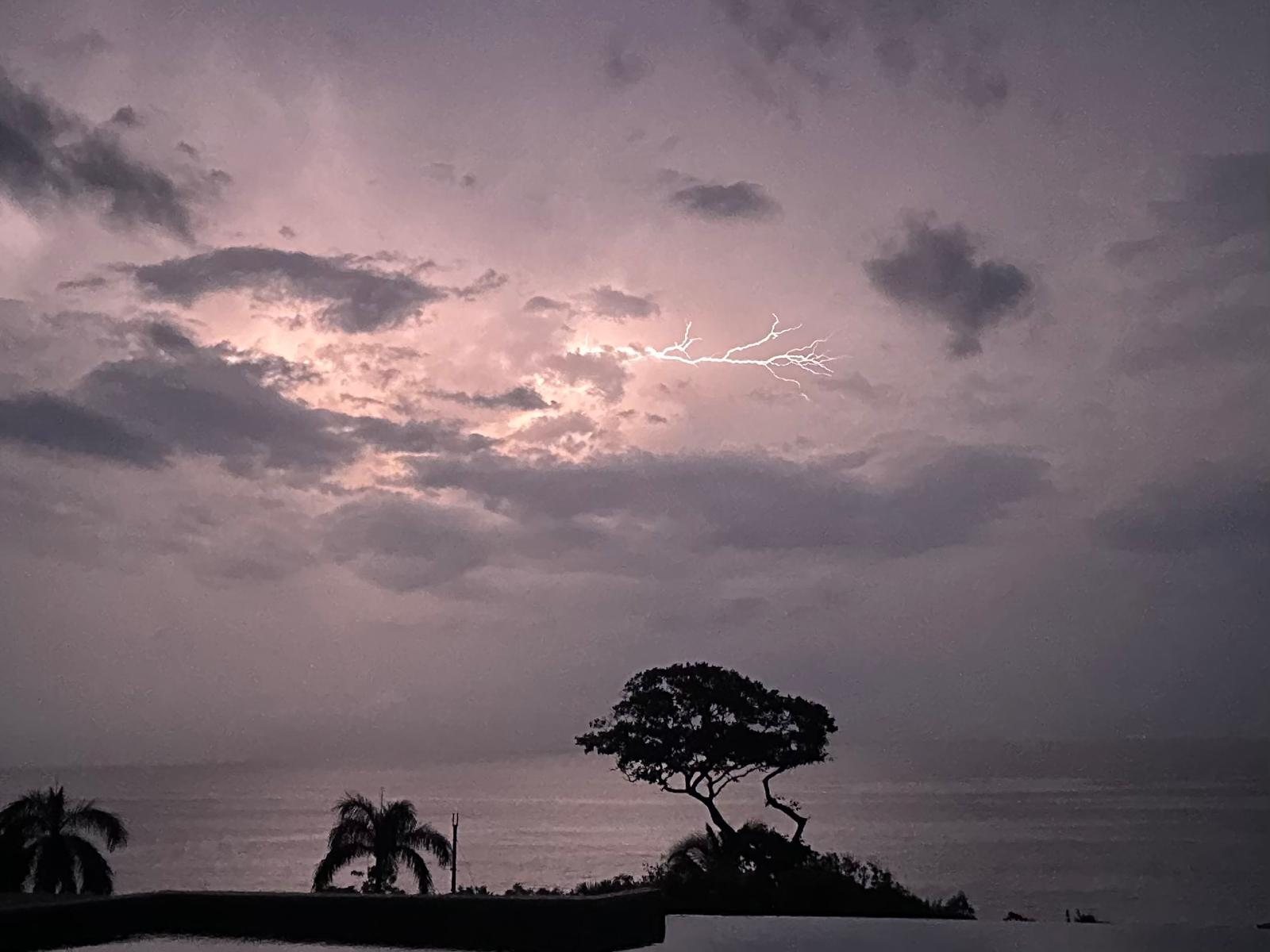 Lightning at sunset over the sea