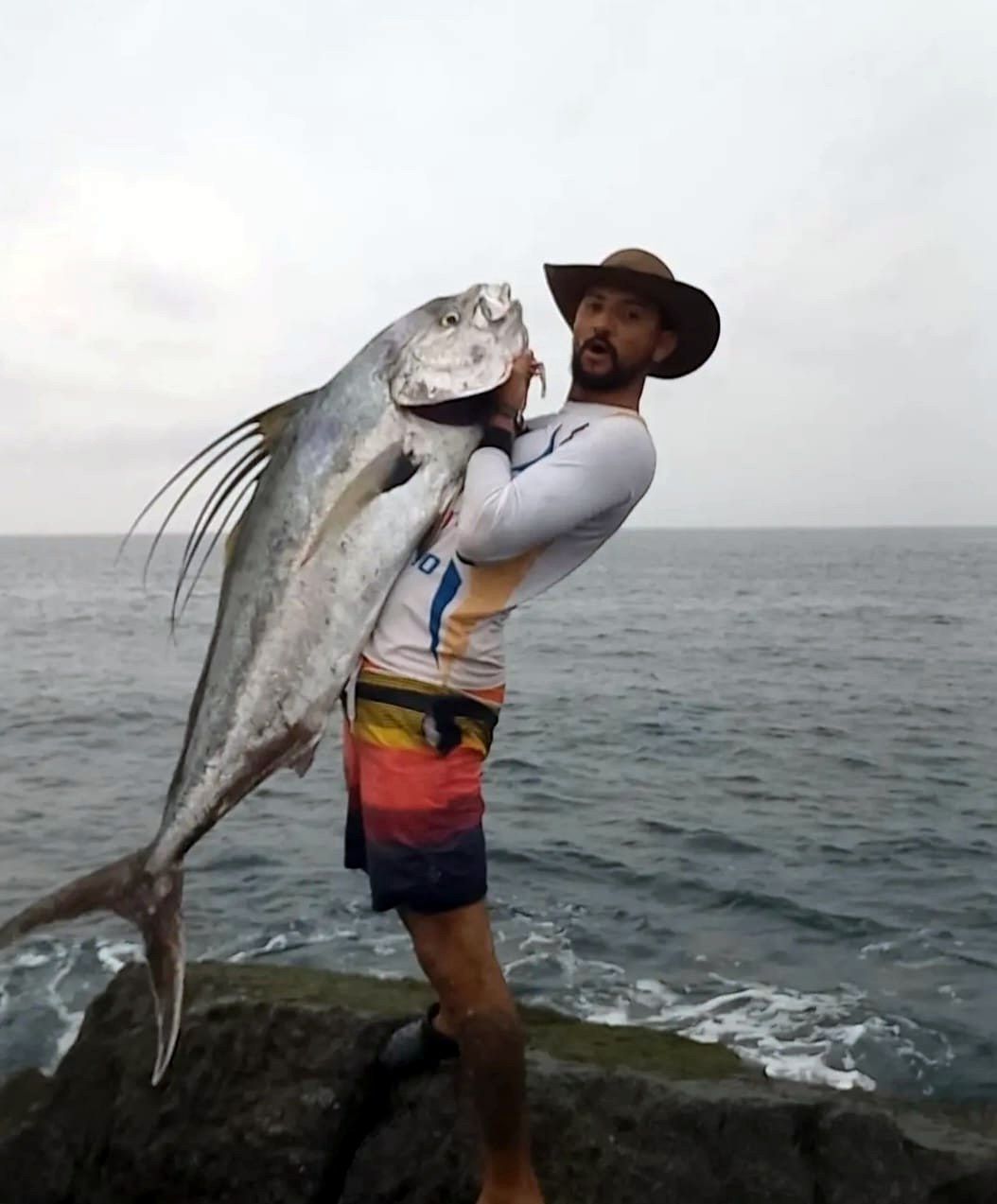 A roosterfish landed from the rocks